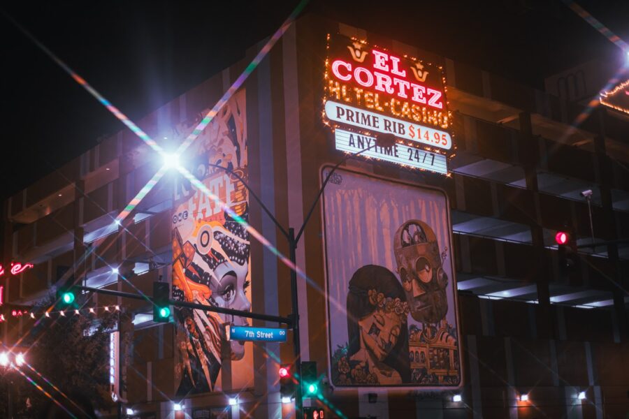 An evening shot outside of El Cortex Hotel in Downtown Las Vegas, including a nearby mural of a robot.